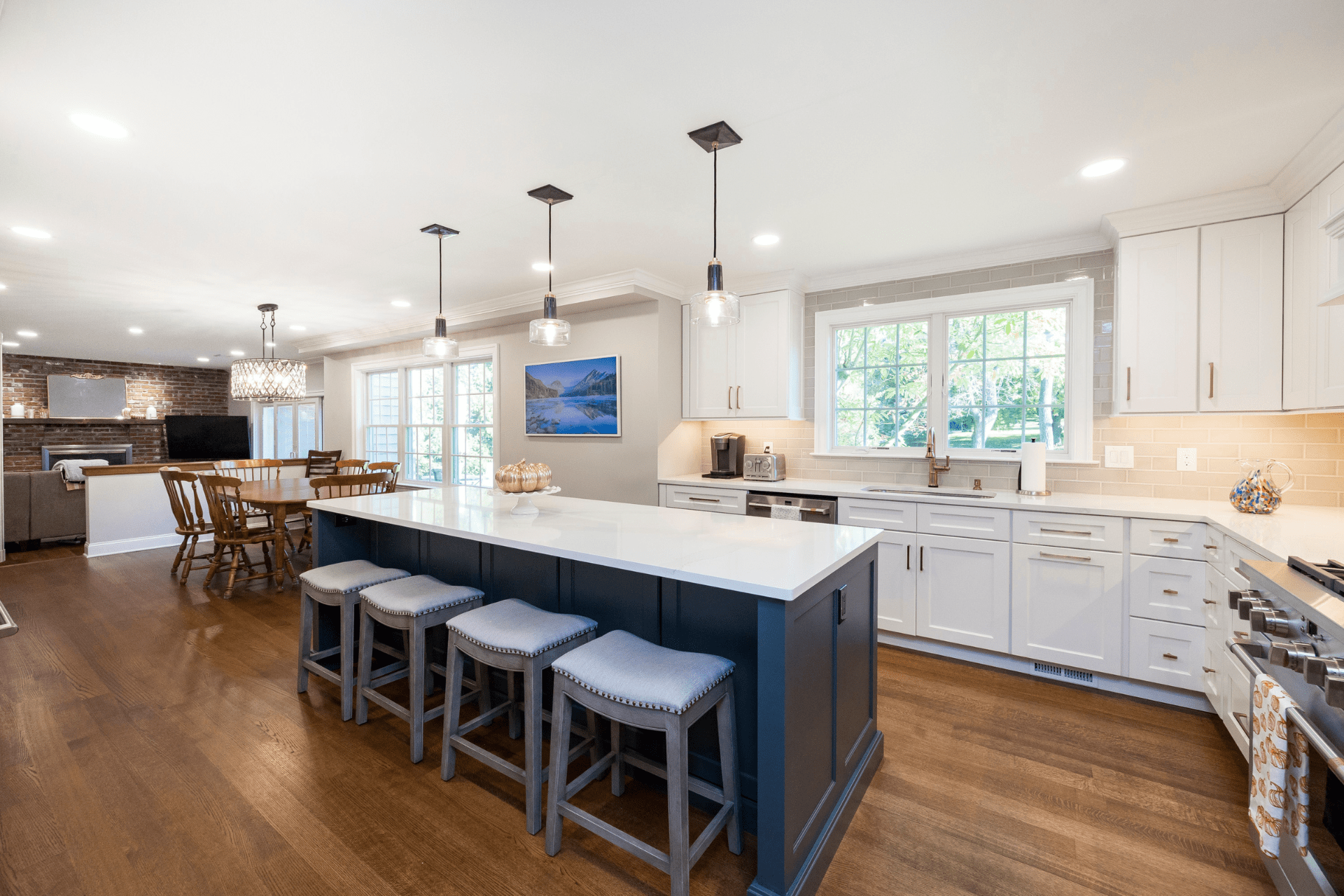 kitchen renovations showcasing a large kitchen island with upholstered stools